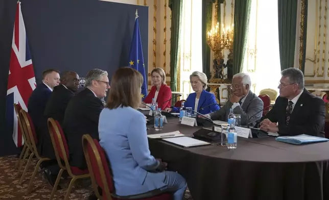 Britain's Prime Minister Keir Starmer, third left, speaks to European Commission President Ursula von der Leyen, third right, and European Council President Antonio Costa, second right, during a meeting between the U.K. and the European Union to discuss closer ties in their first official summit since Brexit, in London, Monday, May 19, 2025.(AP Photo/Kin Cheung, Pool)