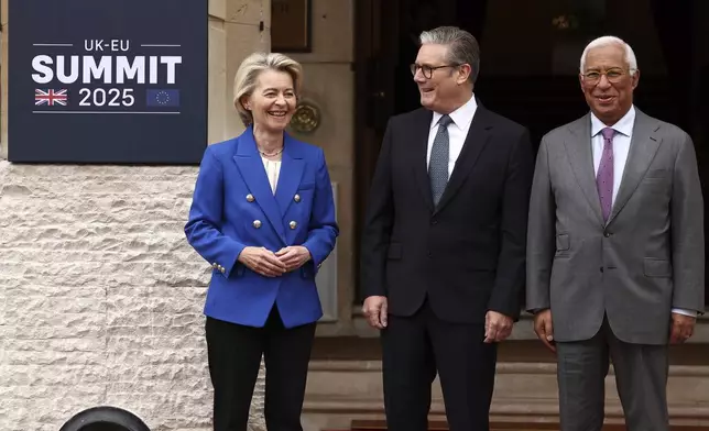 Britain's Prime Minister Keir Starmer, center, stands for a photo with European Commission President Ursula von der Leyen and European Council President Antonio Costa, right, ahead of a United Kingdom and European Union summit at Lancaster House, London, Monday, May 19, 2025. (Henry Nicholls/Pool Photo via AP)