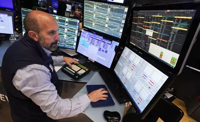 Specialist James Denaro works at his post on the floor of the New York Stock Exchange, Wednesday, May 14, 2025. (AP Photo/Richard Drew)