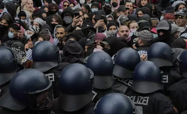 Police officers clash with protesters during a demonstration to commemorate the Nakba Day in Berlin, Germany, Thursday, May 15, 2025. (AP Photo/Ebrahim Noroozi)