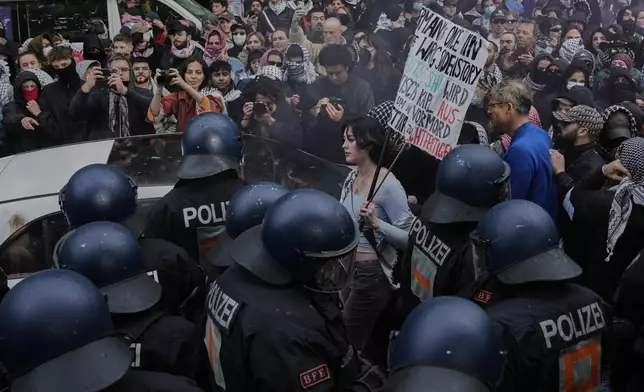Police officers clash with protesters during a demonstration to commemorate the Nakba Day in Berlin, Germany, Thursday, May 15, 2025. (AP Photo/Ebrahim Noroozi)