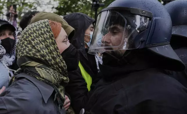Police officers clash with protesters during a demonstration to commemorate the Nakba Day in Berlin, Germany, Thursday, May 15, 2025. (AP Photo/Ebrahim Noroozi)