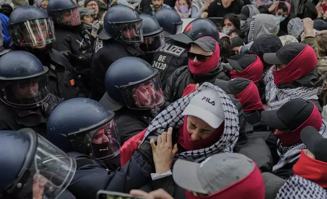 Police officers clash with protesters during a demonstration to commemorate the Nakba Day in Berlin, Germany, Thursday, May 15, 2025. (AP Photo/Ebrahim Noroozi)