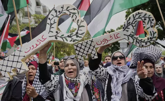 People attend a pro-Palestinians demonstration to commemorate the Nakba Day in Berlin, Germany, Thursday, May 15, 2025. (AP Photo/Ebrahim Noroozi)