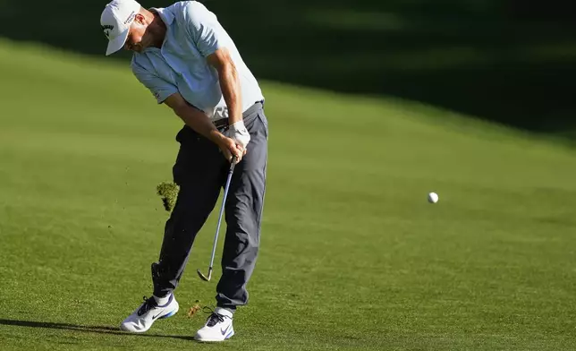 Alex Noren, of Sweden, hits from the fairway on the 18th hole during the third round of the PGA Championship golf tournament at the Quail Hollow Club, Saturday, May 17, 2025, in Charlotte, N.C. (AP Photo/Matt York)