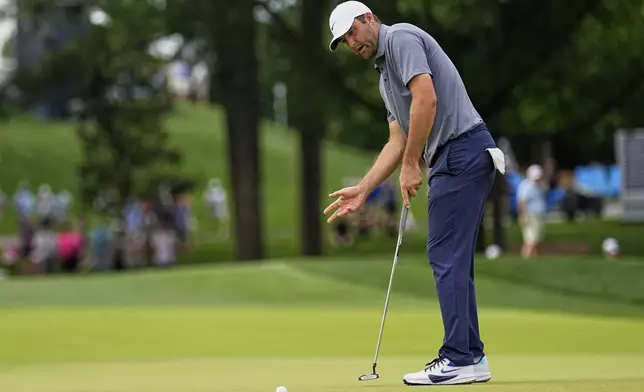 Scottie Scheffler reacts after missing a putt on the 10th hole during the second round of the PGA Championship golf tournament at the Quail Hollow Club, Friday, May 16, 2025, in Charlotte, N.C. (AP Photo/George Walker IV)