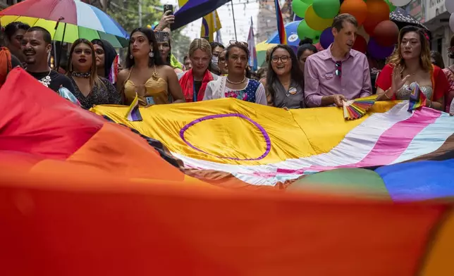 FILE—In this Aug. 20, 2024 file photo, members of the LGBTQ+ community and their supporters participate in the annual pride parade, in Kathmandu, Nepal. (AP Photo/Niranjan Shrestha, File)