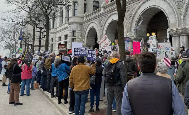 Supporters of Judge Hannah Dugan protest outside the United States Federal Building and Courthouse in Milwaukee, Wis. on Thursday, April 15, 2025 ahead of Dugan's arraignment on charges that she helped a man in the country illegally evade arrest by immigration authorities. (AP Photo/Todd Richmond)