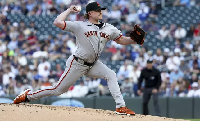 San Francisco Giants pitcher Logan Webb (62) throws to the Minnesota Twins during the first inning of a baseball game Saturday, May 10, 2025, in Minneapolis. (AP Photo/Ellen Schmidt)