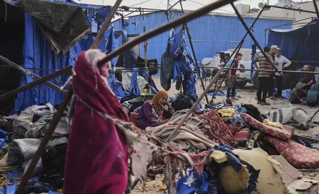 Palestinians inspect the damage caused by an Israeli airstrike that struck tents at Al-Aqsa Hospital in Deir al-Balah, central Gaza Strip, Saturday, May 17, 2025. (AP Photo/Abdel Kareem Hana)