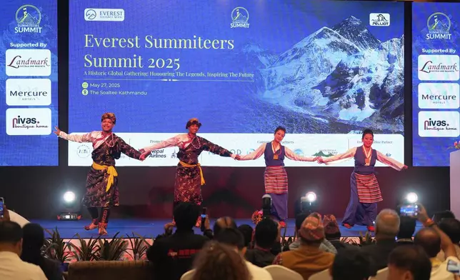 Performers wearing Sherpa attire performs traditional dance during the Everest Summiteers Summit in Kathmandu, Nepal, on Tuesday, May 27, 2025. (AP Photo/Niranjan Shrestha)