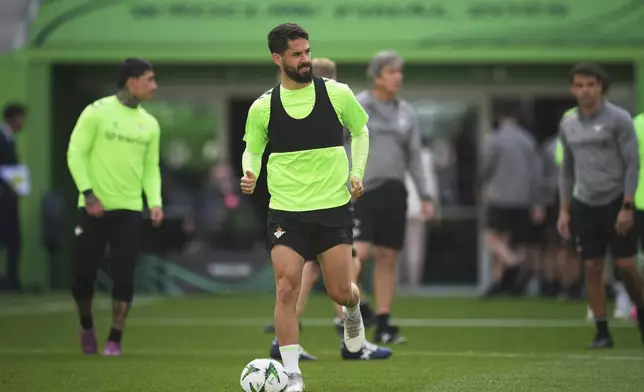 Betis' Isco controls the ball during a training session ahead of the Europa Conference League final soccer match between Real Betis and Chelsea in Wroclaw, Poland, Tuesday, May 27, 2025. (AP Photo/Petr Josek)