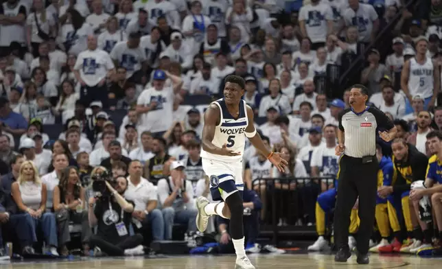 Minnesota Timberwolves guard Anthony Edwards (5) jogs down the court after missing a shot during the first half of Game 1 of an NBA basketball second-round playoff series against the Golden State Warriors, Tuesday, May 6, 2025, in Minneapolis. (AP Photo/Abbie Parr)