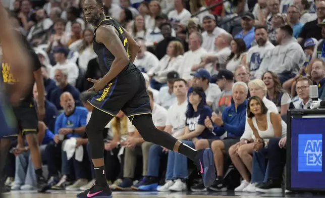 Golden State Warriors forward Draymond Green (23) gestures after making a 3-point shot during the first half of Game 1 of an NBA basketball second-round playoff series against the Minnesota Timberwolves, Tuesday, May 6, 2025, in Minneapolis. (AP Photo/Abbie Parr)