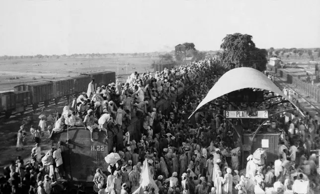 FILE - In this Sept, 27, 1947 file photo, Muslim refugees crowd onto a train bound for Pakistan, as it leaves the New Delhi, India area. (AP Photo, File)