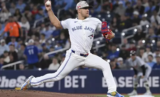 Toronto Blue Jays starting pitcher Jose Berrios throws to a Detroit Tigers batter in first-inning baseball game action in Toronto, Sunday, May 18, 2025. (Jon Blacker/The Canadian Press via AP)