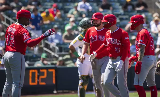 Los Angeles Angels' Taylor Ward (3) celebrates a grand slam during the seventh inning of a baseball game against the Athletics in West Sacramento, Calif., Thursday, May 22, 2025. (AP Photo/Nic Coury)