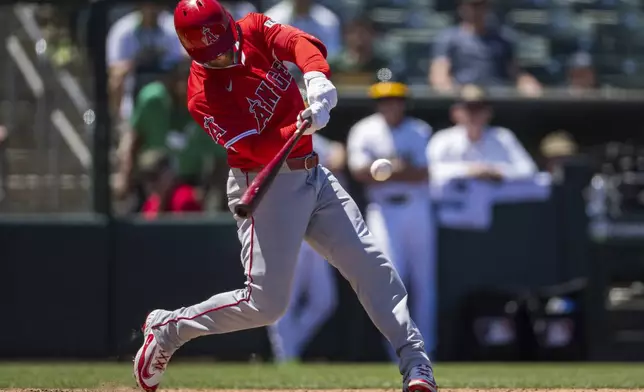 Los Angeles Angels' Taylor Ward hits a grand slam during the seventh inning of a baseball game against the Athletics in West Sacramento, Calif., Thursday, May 22, 2025. (AP Photo/Nic Coury)