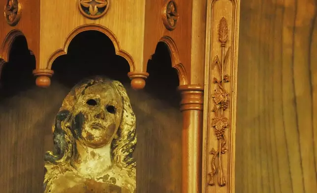 A statue of the Virgin Mary at the Urakami Cathedral that was damaged in the atomic bombing of Nagasaki, southern Japan, Saturday, April 26, 2025. (AP Photo/Eugene Hoshiko)