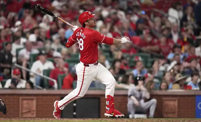St. Louis Cardinals' Nolan Arenado follows through on a three-run triple during the sixth inning of a baseball game against the Arizona Diamondbacks Friday, May 23, 2025, in St. Louis. (AP Photo/Jeff Roberson)