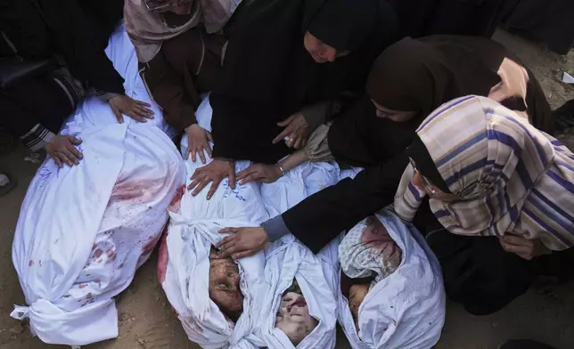Palestinians mourn children from their families who were killed in Israeli airstrikes in Jabalia, in the northern Gaza Strip, on Wednesday, May 14, 2025. According to local hospitals, the strikes killed 48 people, including 22 children. (AP Photo/Jehad Alshrafi)