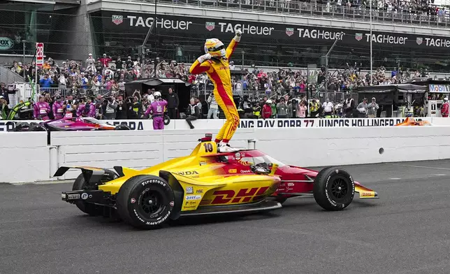 Alex Palou, of Spain, celebrates after winning the Indianapolis 500 auto race at Indianapolis Motor Speedway in Indianapolis, Sunday, May 25, 2025. (AP Photo/AJ Mast)