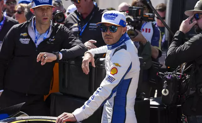 Kyle Larson waits for the start practice for the Indianapolis 500 auto race at Indianapolis Motor Speedway in Indianapolis, Friday, May 23, 2025. (AP Photo/Michael Conroy)