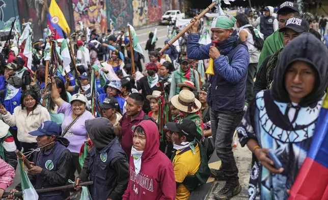 Indigenous supporters of President Gustavo Petro march in favor of a referendum on his labor reform proposal, which he presented to the Senate in Bogotá, Colombia, Thursday, May 1, 2025. (AP Photo/Ivan Valencia)
