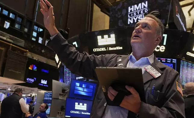 Trader Jonathan Corpina works on the floor of the New York Stock Exchange, Wednesday, May 14, 2025. (AP Photo/Richard Drew)
