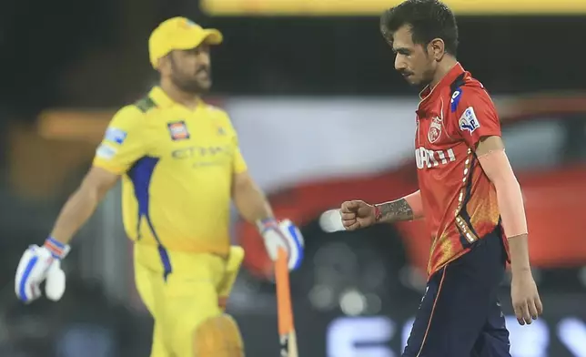 Punjab Kings' Yuzvendra Chahal, right, celebrates the dismissal of Chennai Super Kings' Mahendra Singh Dhoni , left, during the Indian Premier League cricket match between Chennai Super Kings and Punjab Kings' at M. A. Chidambaram Stadium in Chennai, India, Wednesday, April 30, 2025. (AP Photo/R. Parthibhan)