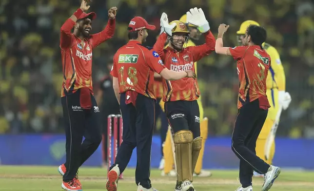 Punjab Kings' Yuzvendra Chahal, right, celebrates the dismissal of Chennai Super Kings' Noor Ahmad with his team mates during the Indian Premier League cricket match between Chennai Super Kings and Punjab Kings' at M. A. Chidambaram Stadium in Chennai, India, Wednesday, April 30, 2025. (AP Photo/R. Parthibhan)