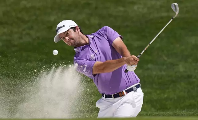 Davis Riley hits from the bunker on the first hole during the final round of the PGA Championship golf tournament at the Quail Hollow Club, Sunday, May 18, 2025, in Charlotte, N.C. (AP Photo/David J. Phillip)