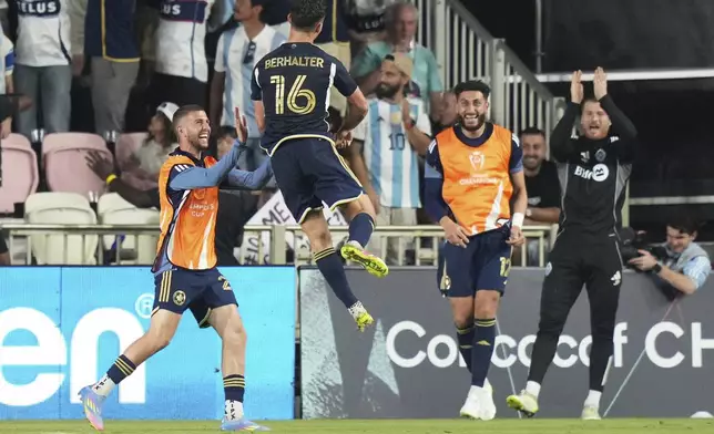Vancouver Whitecaps midfielder Sebastian Berhalter (16) celebrates after scoring a goal during the second half of a CONCACAF Champions Cup second-leg semifinal soccer match against Inter Miami, Wednesday, April 30, 2025, in Fort Lauderdale, Fla. (AP Photo/Lynne Sladky)