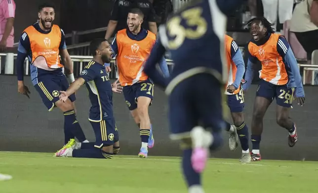Vancouver Whitecaps midfielder Pedro Vite, second from left, celebrates after scoring a goal during the second half of a CONCACAF Champions Cup second-leg semifinal soccer match against Inter Miami, Wednesday, April 30, 2025, in Fort Lauderdale, Fla. (AP Photo/Lynne Sladky)