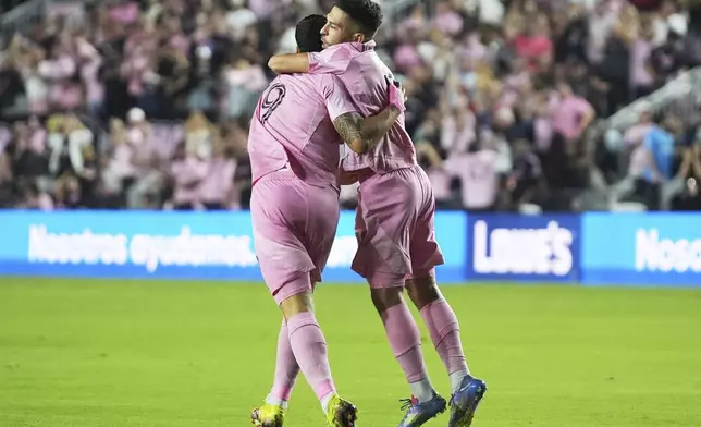 Inter Miami defender Jordi Alba, right, celebrates with forward Luis Suárez (9) after scoring a goal during the first half of a CONCACAF Champions Cup second-leg semifinal soccer match against the Vancouver Whitecaps, Wednesday, April 30, 2025, in Fort Lauderdale, Fla. (AP Photo/Lynne Sladky)
