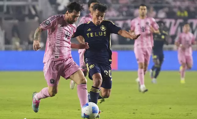 Inter Miami forward Lionel Messi, left, runs for the ball against Vancouver Whitecaps midfielder Andrés Cubas, right, during the first half of a CONCACAF Champions Cup second-leg semifinal soccer match, Wednesday, April 30, 2025, in Fort Lauderdale, Fla. (AP Photo/Lynne Sladky)