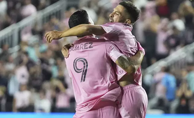 Inter Miami defender Jordi Alba, right, celebrates with forward Luis Suárez (9) after scoring a goal during the first half of a CONCACAF Champions Cup second-leg semifinal soccer match against the Vancouver Whitecaps, Wednesday, April 30, 2025, in Fort Lauderdale, Fla. (AP Photo/Lynne Sladky)