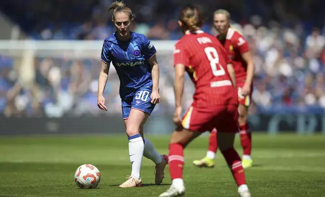Chelsea's Keira Walsh (left) and Liverpool's Fuka Nagano battle for the ball during the Women's Super League soccer match between Chelsea and Liverpool at Stamford Bridge, London, Saturday May 10, 2025. (Rhianna Chadwick/PA via AP)