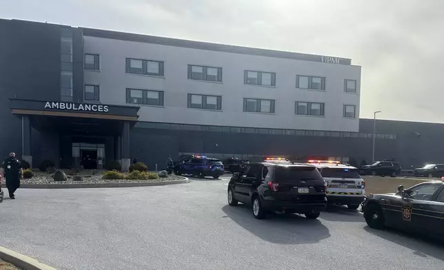 FILE - Law enforcement arrive at the scene of a shooting at UPMC Memorial Hospital in York, Pa., Feb. 22, 2025. (AP Photo/Mark Scolforo, File)