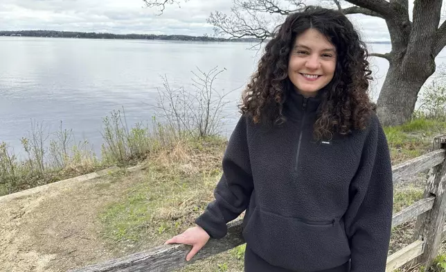 Hannah Kass, one of 61 people indicted on racketeering charges in connection with Atlanta's "Stop Cop City" movement, stands in front of Lake Mendota in Madison, Wis., on May 2, 2025. (AP Photo/Scott Bauer)