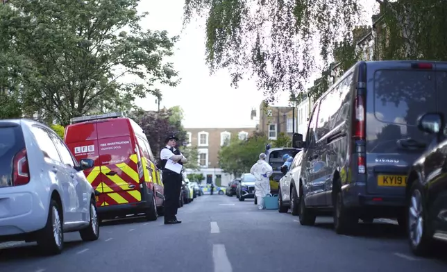 A police officer is seen in Kentish Town, near British Prime Minister Keir Starmer's house in north London, Monday, May 12, 2025. (James Manning/PA via AP)