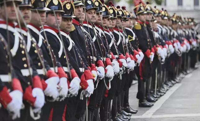 Ceremonial guards line up as the casket of Uruguay's former President Jose Mujica arrives at the Legislative Palace during funeral ceremonies in Montevideo, Uruguay, Wednesday, May 14, 2025. (AP Photo/Santiago Mazzarovich)