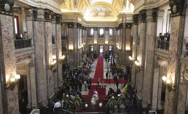 The casket of Uruguay's former President Jose Mujica is on display at the Legislative Palace during his funeral cermemony in Montevideo, Uruguay, Wednesday, May 14, 2025. (AP Photo/Matilde Campodonico)