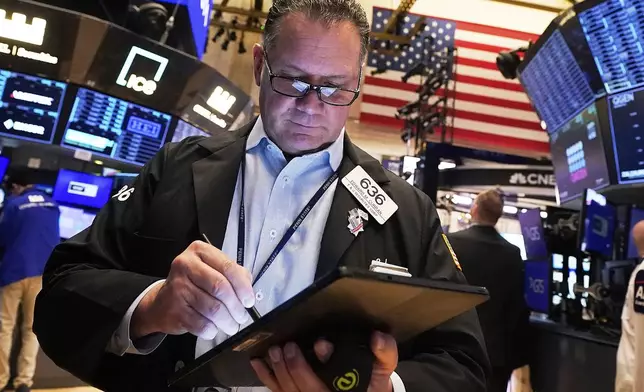 Trader Edward Curran works on the floor of the New York Stock Exchange, Monday, May 5, 2025. (AP Photo/Richard Drew)
