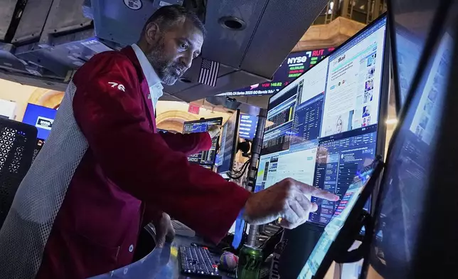 Trader Aman Patel works on the floor of the New York Stock Exchange, Monday, May 5, 2025. (AP Photo/Richard Drew)