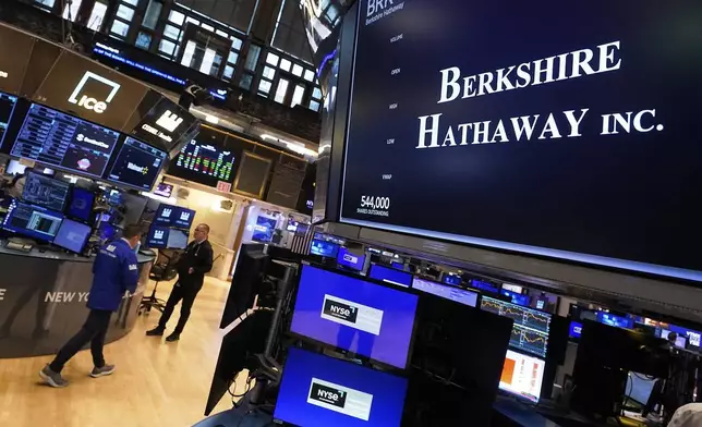 The logo for Berkshire Hathaway Inc. appears above a trading post on the floor of the New York Stock Exchange, Monday, May 5, 2025. (AP Photo/Richard Drew)