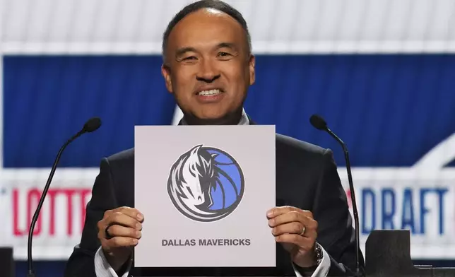 NBA Deputy Commissioner Mark Tatum announces that the Dallas Mavericks won the first pick in the NBA basketball draft lottery in Chicago, Monday, May 12, 2025. (AP Photo/Nam Y. Huh)