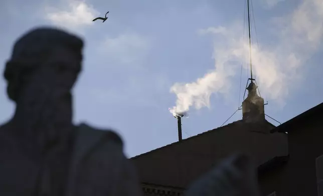 White smoke billows from the chimney of the Sistine Chapel where 133 cardinals are gathering on the second day of the conclave to elect a successor to late Pope Francis, at the Vatican, Thursday, May 8, 2025 (AP Photo/Alessandra Tarantino)
