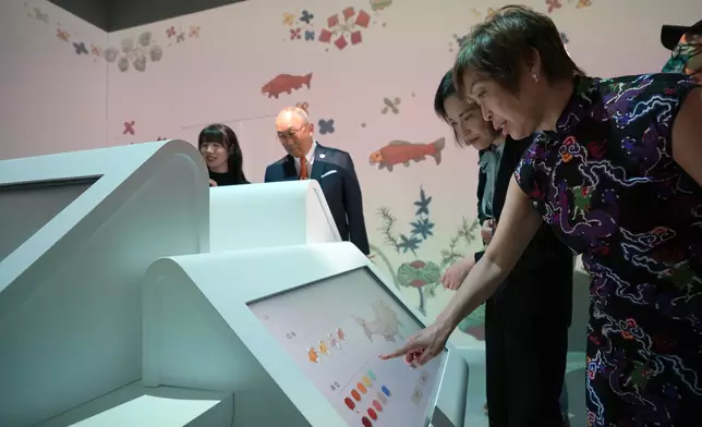 Guests tour the “The Ways in Patterns: An Immersive Digital Exhibition from the Palace Museum”.