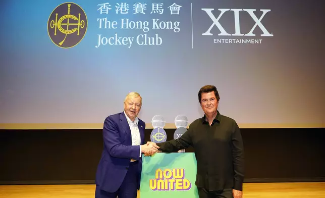 Winfried Engelbrecht-Bresges, CEO of The Hong Kong Jockey Club (left) and Simon Fuller, Founder of XIX Entertainment (right) officiate at the launch ceremony.